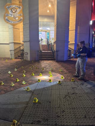 Police investigate the scene of a shooting near the CDC campus and Emory University in Atlanta, Georgia. The suspected gunman is dead after officials say he killed a DeKalb County police officer